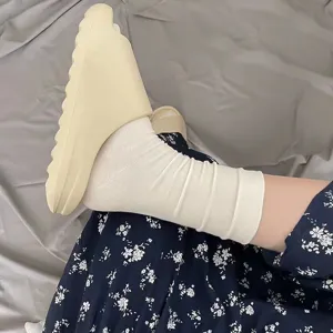 Comfortable white mid-calf socks for women, soft cotton casual daily wear detail view.