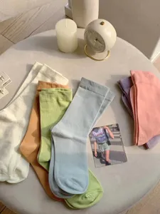 Candy color cotton mid-tube socks for women, soft breathable daily casual hosiery.
