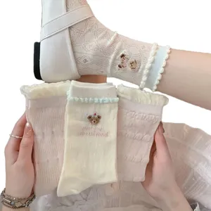 Cute women's lace hollow-out mid-calf socks with sweet bear embroidery and ruffles for summer.