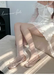 Sheer mesh polka dot mid tube socks paired with pink satin ballet flat shoes for women.