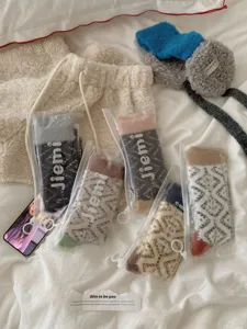 Detailed view of cozy fuzzy coral fleece women socks, thick winter sleep socks for home.