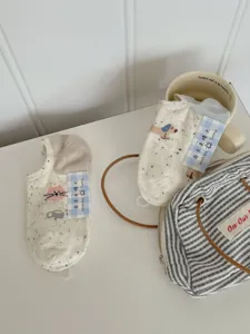 Detailed shot of cute cartoon cat and dog pattern cotton invisible shallow boat socks.