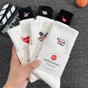 Trendy embroidered mid-tube socks featuring cute animal and heart designs for couples daily wear.
