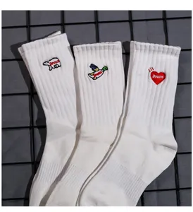 White mid-tube cotton socks with cute embroidered animal and heart designs for casual wear.