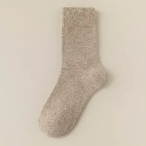 Close-up detail of cozy winter wool blend mid-tube sock in solid oatmeal color warm comfy