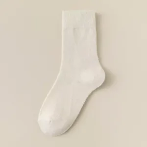 Thickened solid color mid-tube wool socks designed for autumn and winter warmth and comfort.