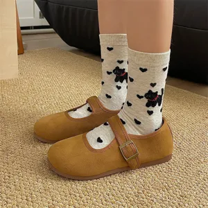 Cute cartoon cat mid-calf socks paired with vintage brown Mary Jane shoes for spring.
