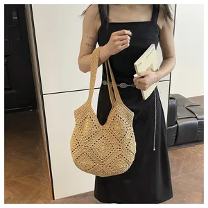 Minimalist straw woven tote bag for women, chic handmade shoulder handbag for beach vacation.