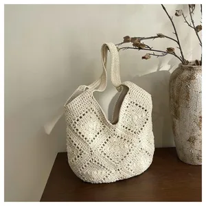 Handmade crochet tote bag detailed view, aesthetic beige woven shoulder bag texture.