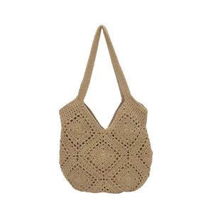 Detailed view of the crochet hollow texture and strap design of the stylish women's shoulder bag.