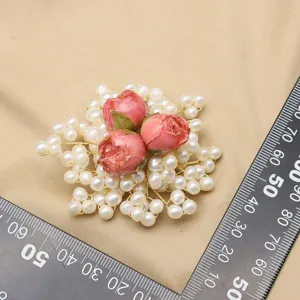 Elegant pearl and resin rose brooch, handmade floral corsage pin for women apparel decoration.
