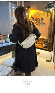 Detail view of casual nylon chest bag worn across body in cafe setting, stylish daily wear.