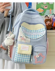 Japanese candy color large capacity patchwork student backpack detail view with cute plush bunny charm.