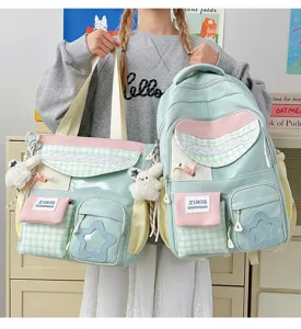 Detailed view of sweet pastel color block student backpack and tote bag with cute charms.
