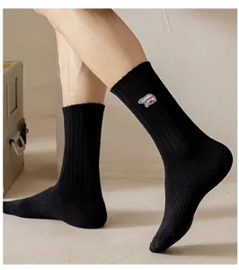 Black ribbed mid-calf socks featuring cute bear embroidery, perfect for street style daily wear.
