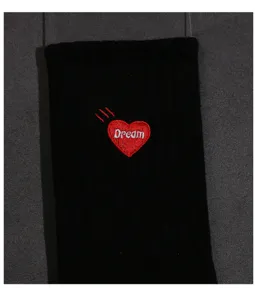 Black mid-calf casual socks featuring a red heart embroidery and white dream text detail.