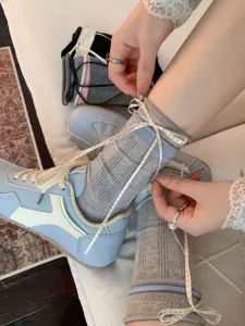 Grey ribbed socks with polka dot ribbon ties, cute balletcore style mid-calf socks for women.