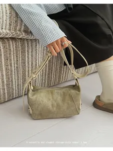 Vintage canvas underarm bag for women, casual retro shoulder bag with adjustable leather strap.