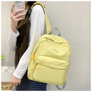 Minimalistischer Briefdruck großer Kapazität Schüler Schultucksack, lässige gelbe Freizeittasche.