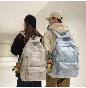 Large capacity nylon school backpack with letter print and cute dinosaur pendant for campus students.