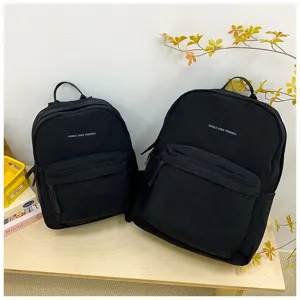Minimalistischer Buchstabe Druck große Kapazität Leinwand Schüler Rucksack Detail.