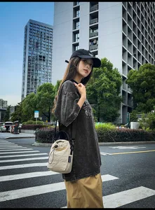 Casual minimalist drawstring canvas bucket bag, stylish women's shoulder crossbody bag for daily use.