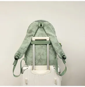 Casual green nylon backpack with smiley face print, large capacity school bag for students.