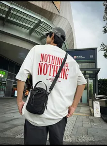Casual black canvas bucket bag for women, featuring adjustable shoulder strap and top handle.