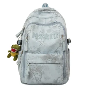 Light blue nylon backpack with cute dinosaur pendant, large capacity school bookbag for teens.