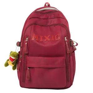 Minimalist nylon letter large capacity school backpack for women with cute plush pendant.