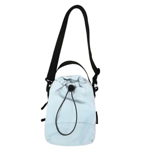 Casual minimalist light blue drawstring bucket bag featuring a convenient black strap and top handle.
