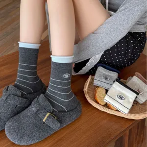 Grey cotton mid-tube socks with stripes and cute embroidery for women spring wear.