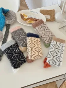 Cozy winter coral fleece fuzzy socks for women, thick warm home mid-tube geometric design.