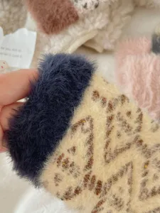 Coral fleece sleep socks detail closeup showcasing ultra-soft plush texture and warm fit.