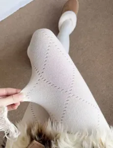 Grey winter cotton knit tights detail view, elastic retro diamond pattern pantyhose.