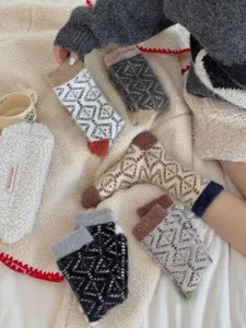 Cozy thick warm coral fleece winter mid-tube socks with cute geometric patterns for home wear.