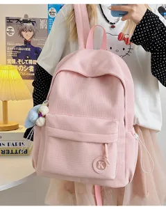 Detailed view of the minimalist pink plaid student backpack, large capacity for school and travel.