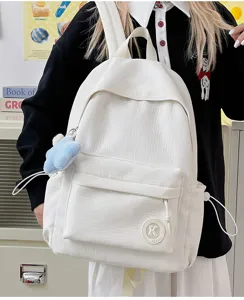 Minimalist white corduroy backpack with large capacity, ideal for students and daily commute travel.