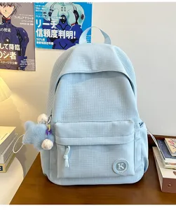 Light blue plaid student backpack detail view, large capacity casual campus book bag commute.