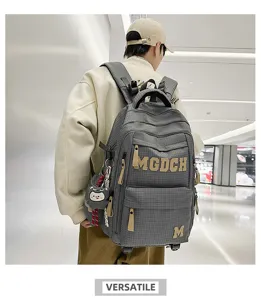 Stylish college style plaid student backpack with large capacity and letter embroidery for daily use.