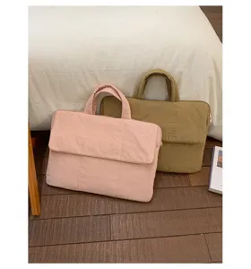Detailed view of the padded cotton laptop handbag in pink and khaki for daily commuting.