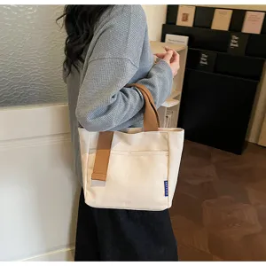 Borsa shopper casual in tela da donna, borsa a mano minimalista con manici marroni.