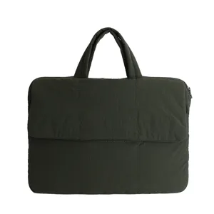 Dark green quilted laptop bag, thickened commuter handbag, solid color document pouch detail.