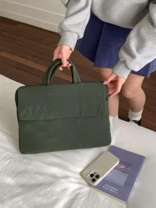 Dark green padded laptop bag with handles, stylish minimalist design for daily commute work.
