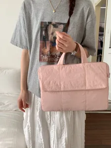 Pink padded laptop bag for women, soft quilted commuter handbag and document case for daily office.