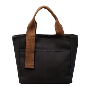 Borsa tote in tela casual con manici marroni e tasca frontale, elegante borsa a mano.