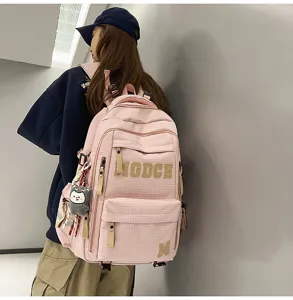 Pink plaid student school bag large capacity college style backpack for teenagers daily use.