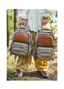Large capacity color block school backpack for students, outdoor travel and hiking use.