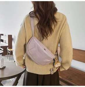 Casual candy color crescent crossbody bag detail, stylish women's streetwear chest bag daily wear.