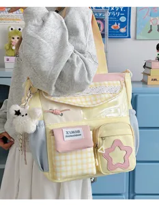 Detail view of Japanese candy color canvas backpack with transparent pocket and plush pendant
